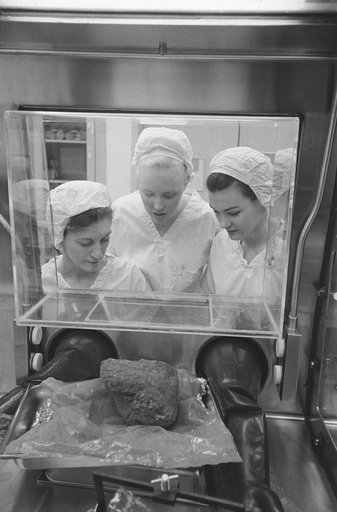 Technicians examine largest lunar rock sample collected