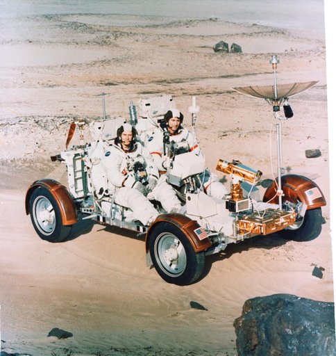 Astronauts Young and Duke begin simulated lunar surface traverse at KSC
