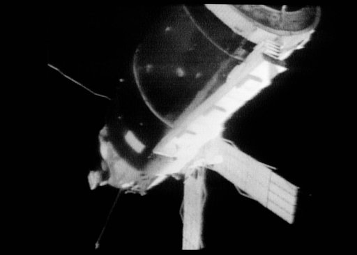 View of the Skylab 1 space station cluster from the Skylab 2 Command Module