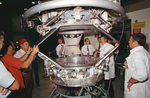 American & Soviet engineers examine ASTP docking set-up following tests