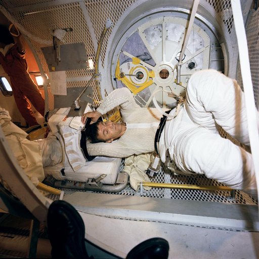 Astronaut Joe H. Engle, commander of STS-2, in suit donning/doffing exercise