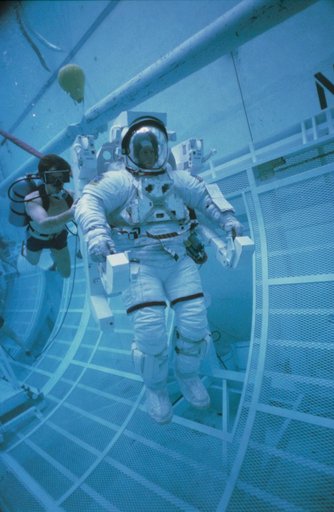 Underwater EVA training in the WETF with astronauts Nelson and van Hoften