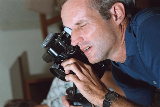 View of STS 51-D crew commander Karol Bobko training with Arriflex camera