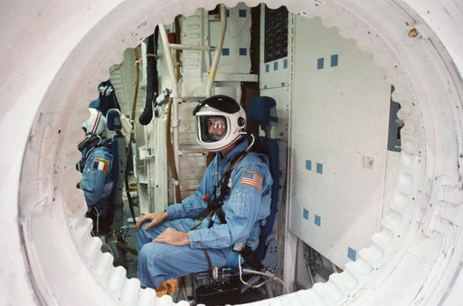 STS 51-E crew is briefed on the Shuttle full fuselage trainer