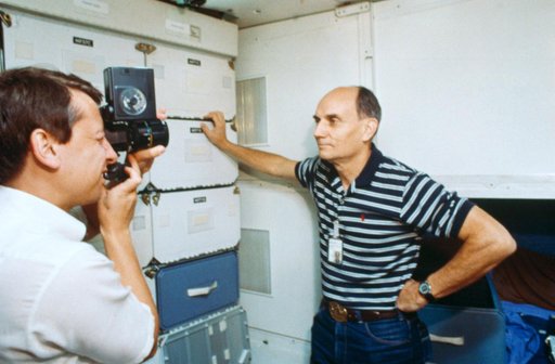Sen. Jake Garn and payload specialist Charles Waler in middeck simulation
