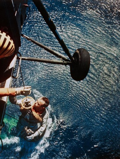 Astronaut Alan Shepard is rescued by helicopter at end of MR-3 flight