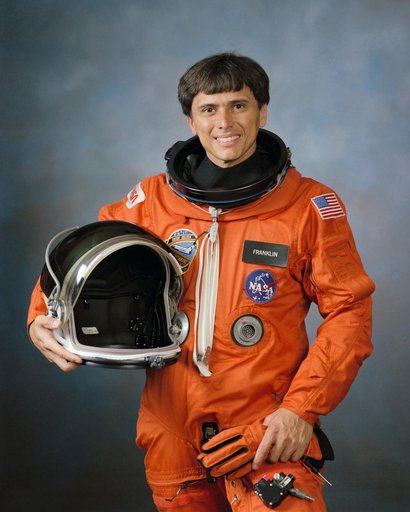 Official photo of Astronaut Mission Specialist Franklin Chang Diaz in orange