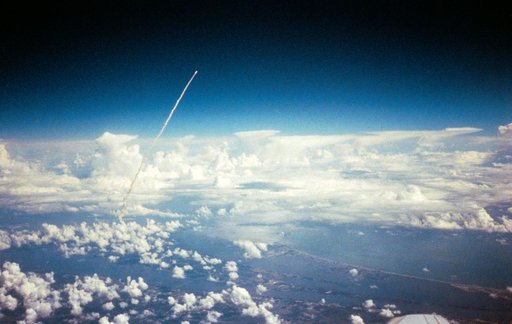 Long range view of an unidentified space shuttle lift off taken from an