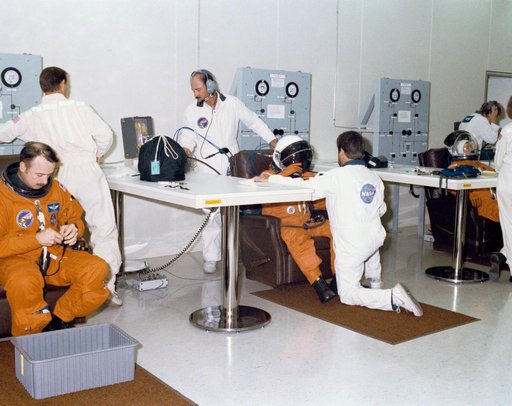 KSC supplied views of the STS 28 crew suiting up, at  breakfast and