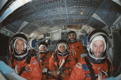 STS-34 crew poses on flight deck of JSC's crew compartment trainer (CCT)