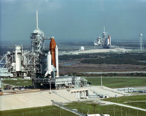 Rare view of two space shuttles on adjacent KSC Launch Complex (LC) 39 pads