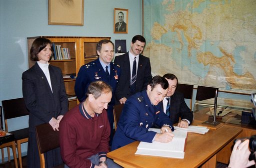 Astronauts & cosmonauts sign Gagarin's diary