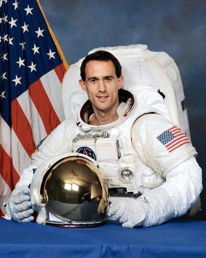 Portrait of astronaut James H. Newman in his EMU