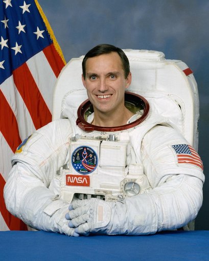 Portrait of astronaut Carl E. Walz in his EMU
