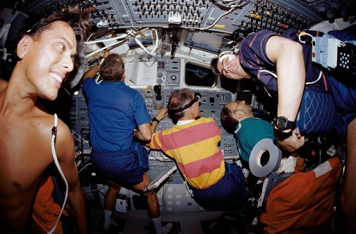 STS-46 crewmembers work on OV-104's aft flight deck