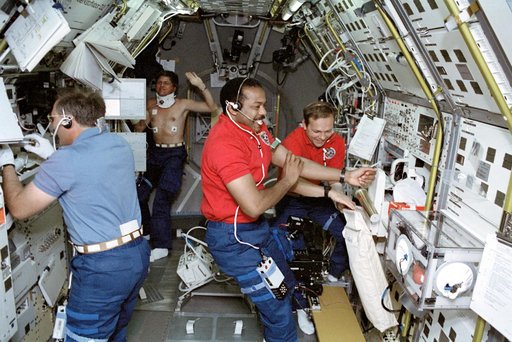 STS-55 crewmembers work in the SL-D2 module onboard OV-102
