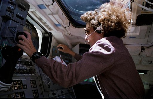 STS-57 MS2 Sherlock operates RMS THC on OV-105's aft flight deck