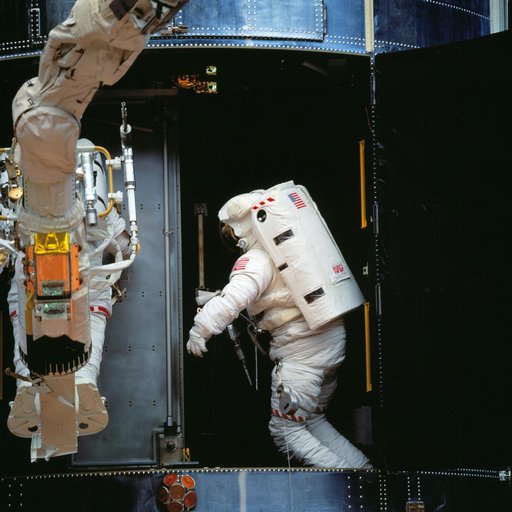 Astronauts Akers and Thornton during installation of COSTAR on HST