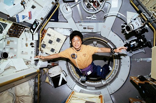 STS-65 Payload Specialist Mukai enters IML-2 spacelab module aboard OV-102