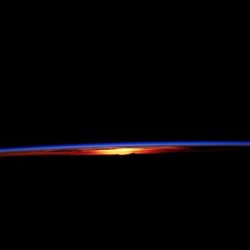 STS-67 sunset and earth limb view