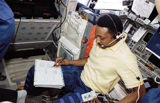 Crew activity in the flight deck during first EVA of STS-72