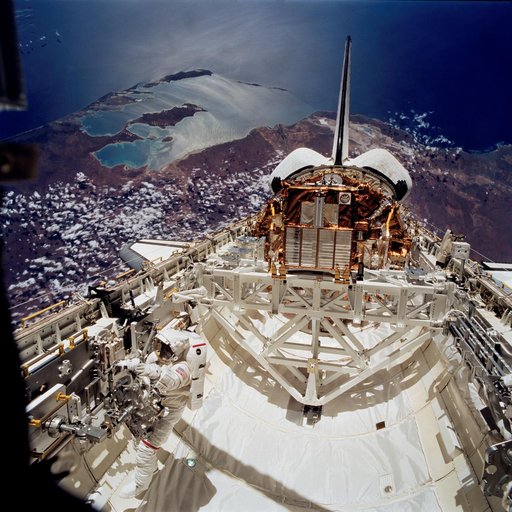 Payload bay activity during second EVA of STS-72 mission