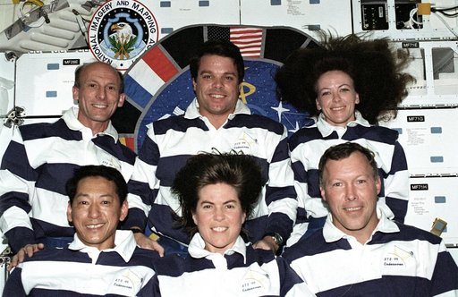 The STS-99 crew pose for their inflight portrait on OV-105's middeck