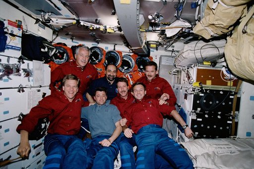 STS-100 crew poses for the inflight crew photo on the middeck of Endeavour during STS-100
