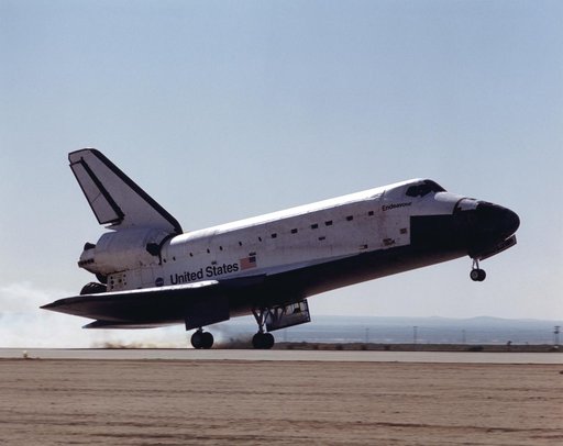 View of Endeavour touching down at Edwards AFB during STS-100's landing