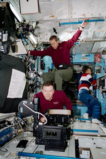 Wetherbee 'surfs' on the back of Kelly in the U.S. Laboratory
