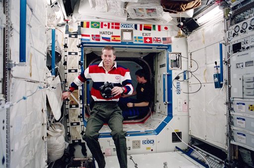 Wetherbee takes a photo in the ISS U.S. Laboratory