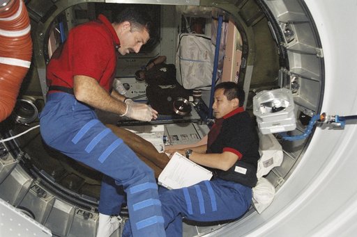 MS Burbank and MS Lu work in PMA1 during STS-106