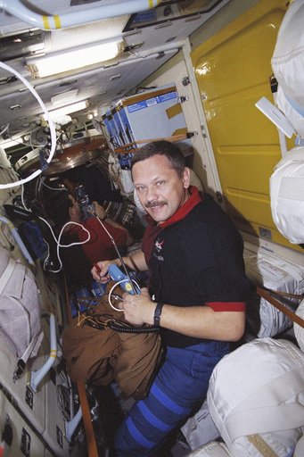 Morukov and Altman among stowage bags in Zarya taken during STS-106