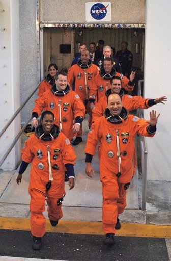 STS-116 crew exits Operations and Checkout Building
