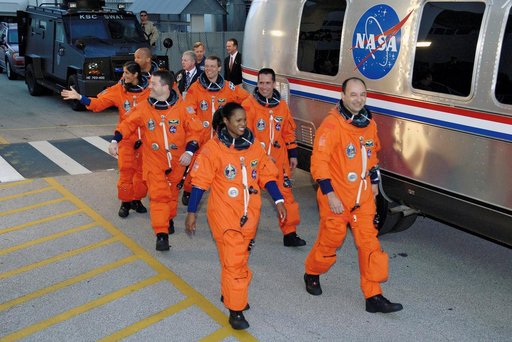 STS-116 crew exits Operations and Checkout Building