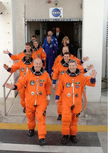STS-122 crew leave the Operations and Checkout bldg at KSC