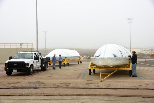 Delta II JPSS-1 Fairing Bi-Sector Halves Hoisted to MST