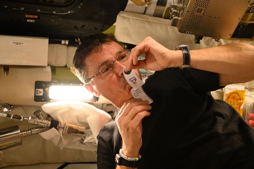 Reid Wiseman Collects Saliva Sample Aboard Orion