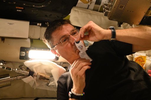 Reid Wiseman Collects Saliva Sample Aboard Orion