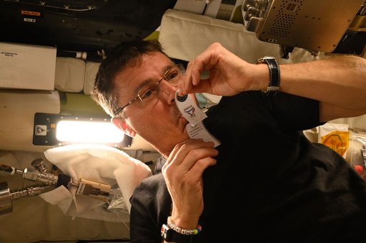 Reid Wiseman Collects Saliva Sample Aboard Orion