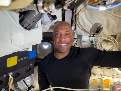 Victor Glover Poses With Earth in View