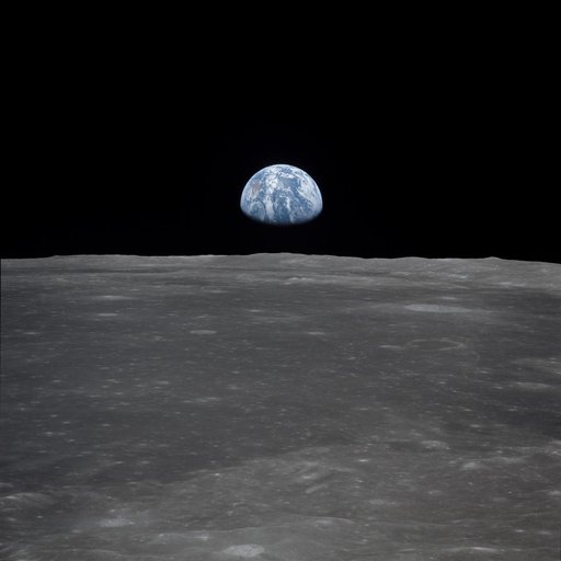 Apollo 11 Mission image - View of moon limb, with Earth on the horizon