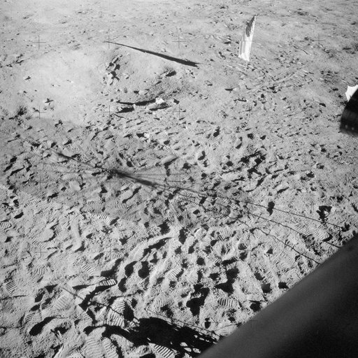 Apollo 12 Mission image - View of footprints and the flag pole as taken from the Lunar Module (LM)