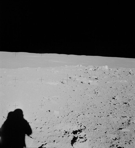 Apollo 14 crewmen photographs field of boulders on flank of Cone Crater