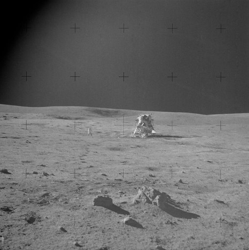 Apollo 14 Mission image - View of the Lunar Module with Triplet and an Astronaut in the background.