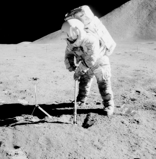 Astronaut James Irwin uses scoop during Apollo 15 EVA