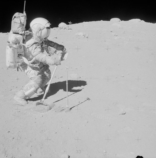 Astronaut John Young photographed collecting lunar samples