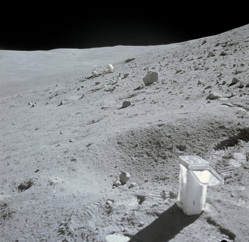 Lunar Roving Vehicle parked in lunar depression on slope of Stone Mountain