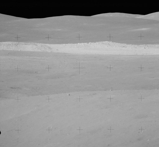 View of rim of South Ray crater on traverse up Stone Mountain during EVA