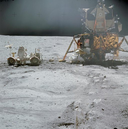 Astronaut John Young at LRV prior to deployment of ALSEP during first EVA